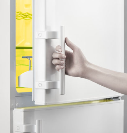 Opening empty fridge for cleaning