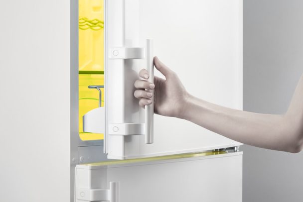Opening empty fridge for cleaning