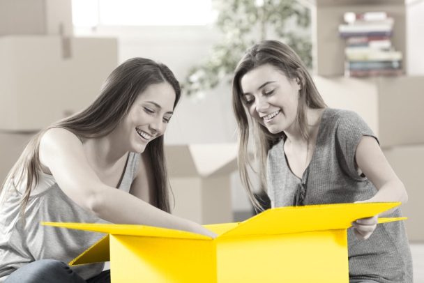 Siblings living together unpacking