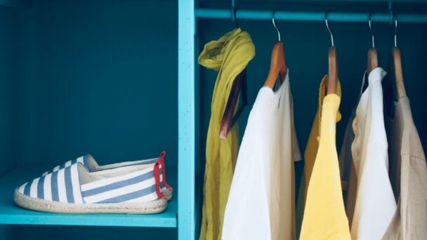 Open wardrobe with clothes in it